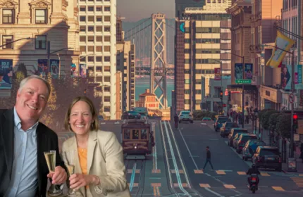Emily Schelle-Miller and a colleague celebrating Beacon Hill Associates® expansion in San Francisco with the Bay Bridge and city skyline in the background.