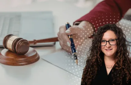 Professional legal workspace with a gavel, laptop, and documents, with a team member highlighted in the foreground to represent the impact of the Legal Division.