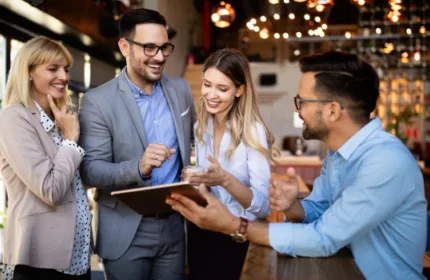 Beacon Hill employees collaborating during a team meeting, reflecting a workplace culture recognized by USA Today as a Top Workplace in 2026.