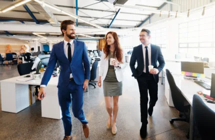 Three coworkers walk and smile, celebrating Beacon Hill Named One of the Largest Staffing Firms in the U.S. for 11th Consecutive Year