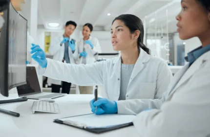 Team works together in a project reflecting Quality Systems Modernization for Enterprise Manufacturing Operations