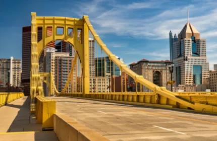 Yellow bridge and Pittsburgh skyline representing Beacon Hill Pittsburgh’s 2026 Best Places to Work recognition