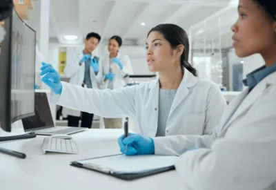 Team works together in a project reflecting Quality Systems Modernization for Enterprise Manufacturing Operations
