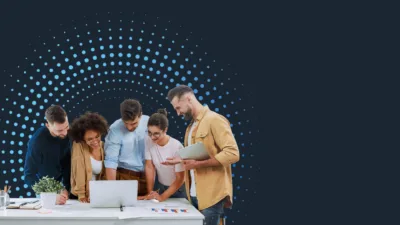 Professionals reviewing workforce data together with a digital dot pattern in the background.