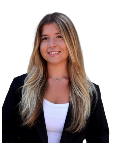 Natalie smiling in a professional headshot, wearing a black blazer and white top.