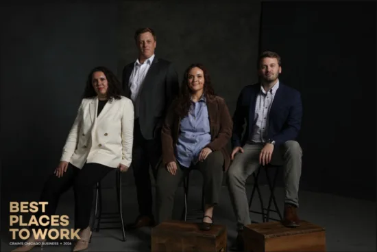 Four Beacon Hill team members pictured with Best Places to Work recognition branding.