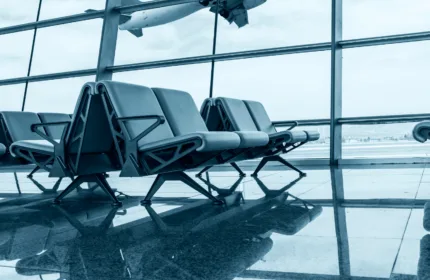 Airport terminal scene with travelers and infrastructure, representing aviation and public sector airport operations — Beacon Hill Government Services staffing for airports and transportation agencies.