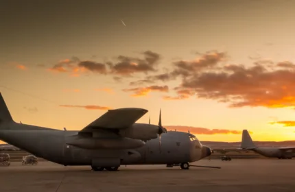 Military aircraft on a runway at sunset, representing operational and technical support for defense aviation.
