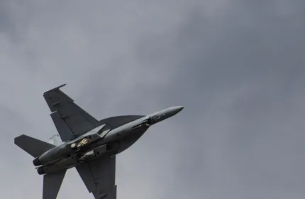 A jet aircraft in flight, symbolizing engineering and strategic support for missile defense initiatives.
