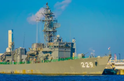 A naval ship at sea, representing engineering, logistics, and defense program support for naval operations.