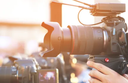 A creative team filming content, representing financial oversight for media and entertainment operations.