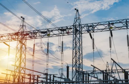 High-voltage towers, symbolizing IT services for energy and utility infrastructure.