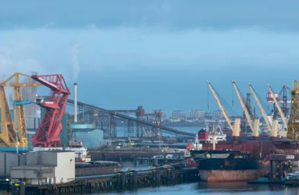Cargo ship at port representing maritime and shipping operation.