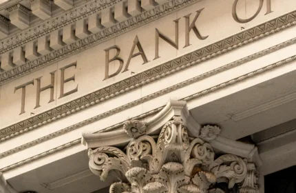 Investment banking professionals analyzing financial data.