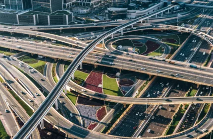 Multi-level highway interchange in a modern city, representing transportation services.