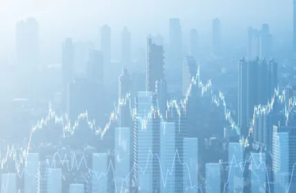 A city skyline is overlaid with financial charts and market performance data, representing investment banking services, capital markets activity and financial advisory solutions.