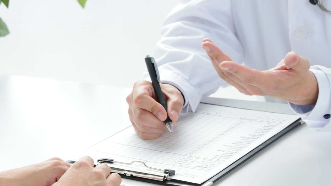 Medical professional consulting with patient