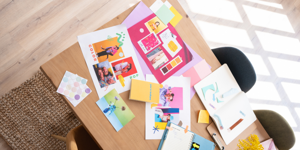 Marketing planning desk with visual content layouts, color swatches, and campaign inspiration