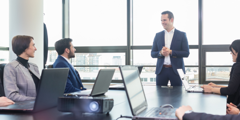 Business professionals working on corporate accounting tasks.