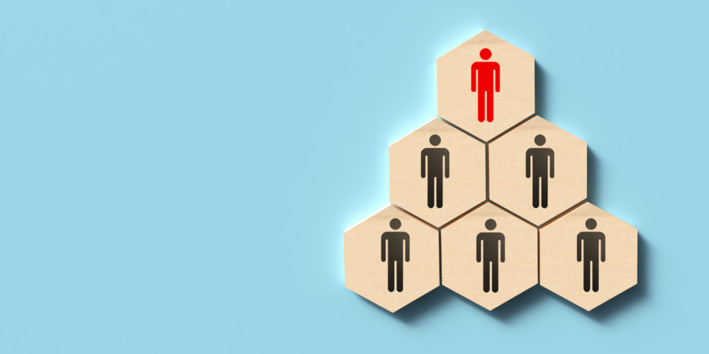 A digital graphic illustrating HRIS, HR technology, and HR analytics, featuring icons of people and data elements emerging from a tablet to represent workforce .insights and automation.