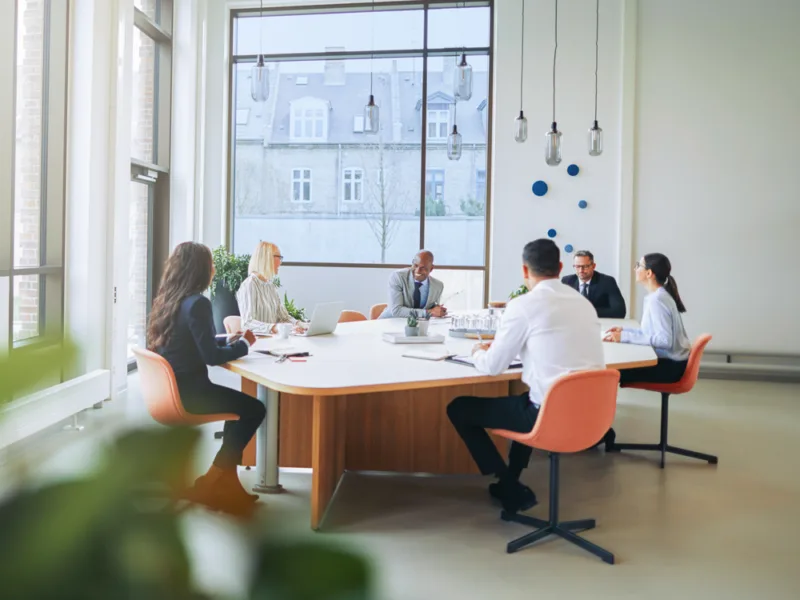 Legal recruiters from a legal staffing agency meeting to discuss hiring needs