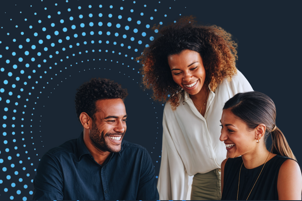 Business professionals collaborating around a laptop with abstract data points and a modern digital background, representing cautious optimism in the labor market.